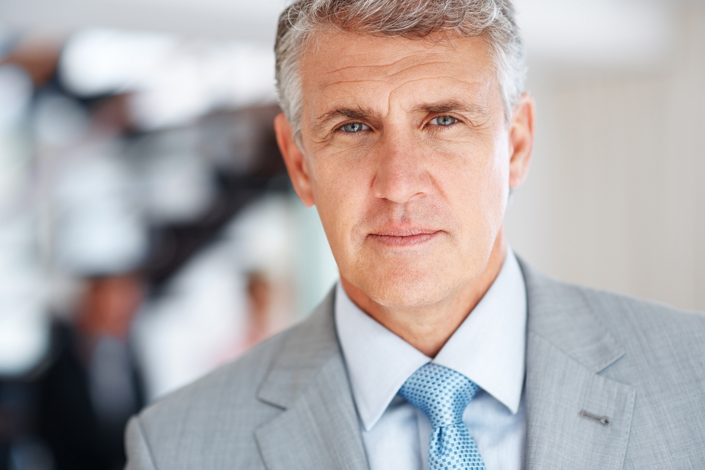 Portrait image of a caucasian man in a suit