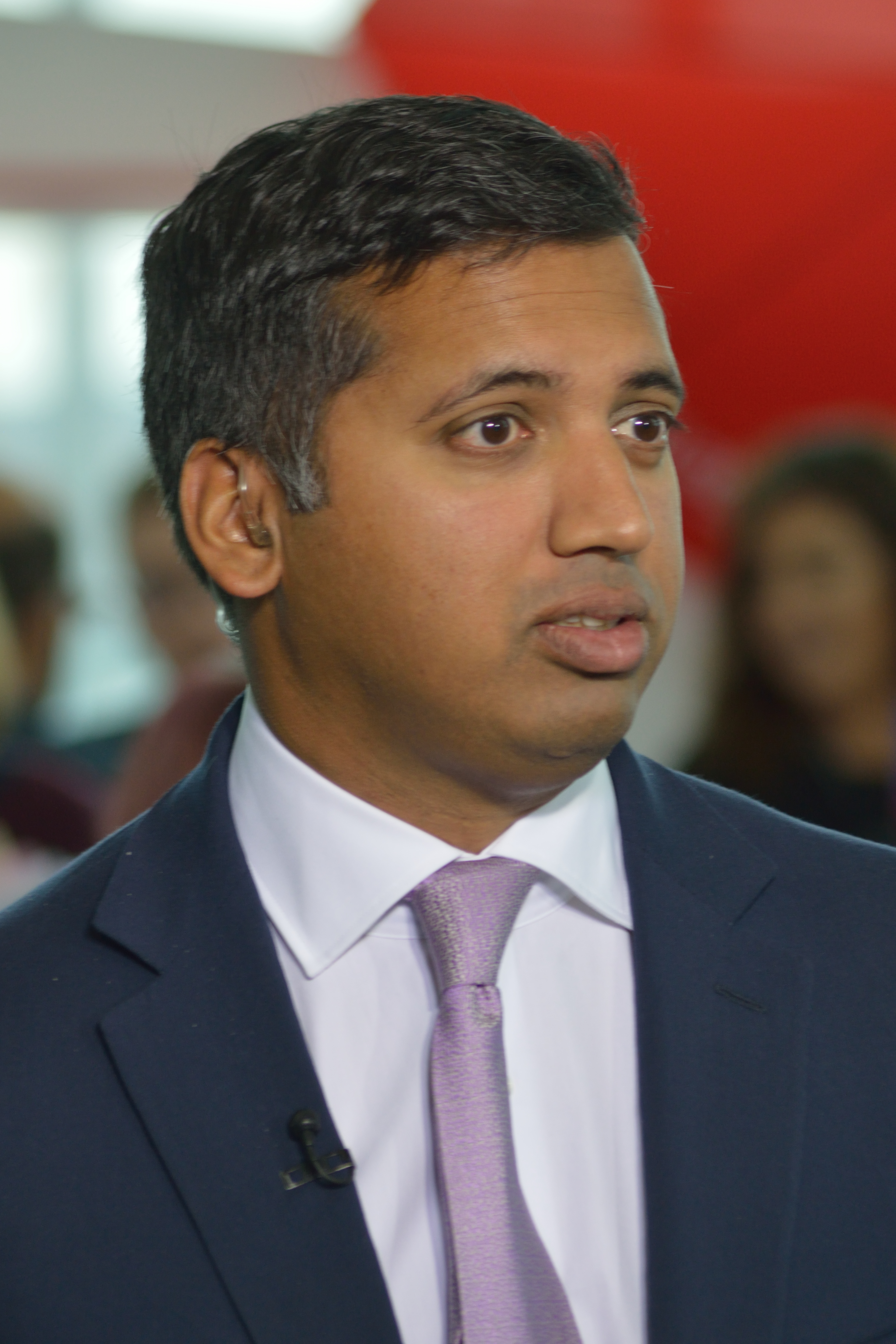 Portrait image of a middle-eastern man in a suit